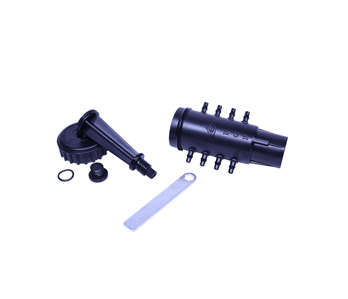 Unassembled black Octo-Flow manifold shows the unique hex key plunger system for water flow control