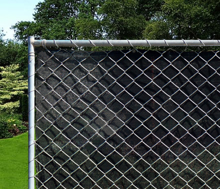 Privacy fencing is made to attach easily to an existing chain link fence rail