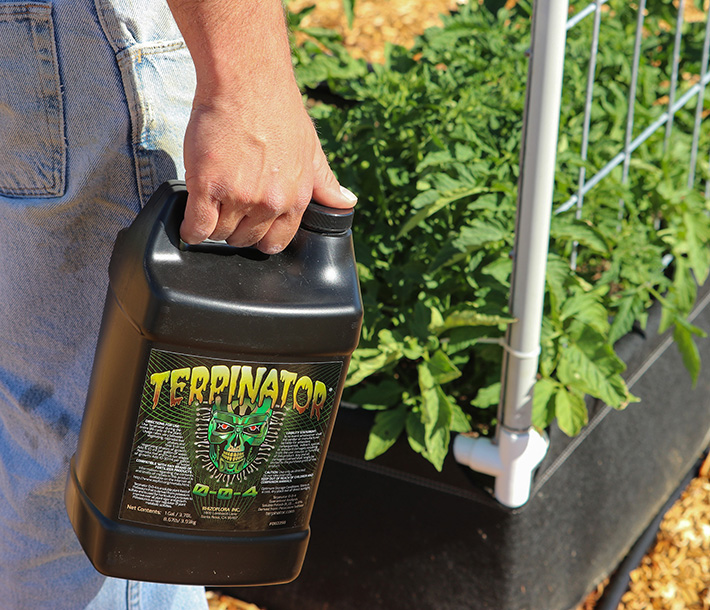 Terpinator, being carried past a GeoPlanter Fabric Raised Bed, enhances the potency of medicinal plants