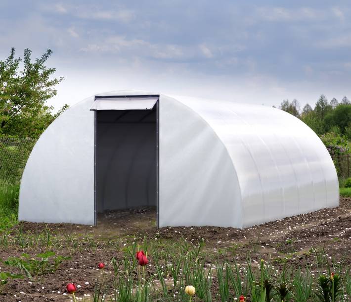 Outside view of Sungrower Supply Blackout poly on a greenhouse frame