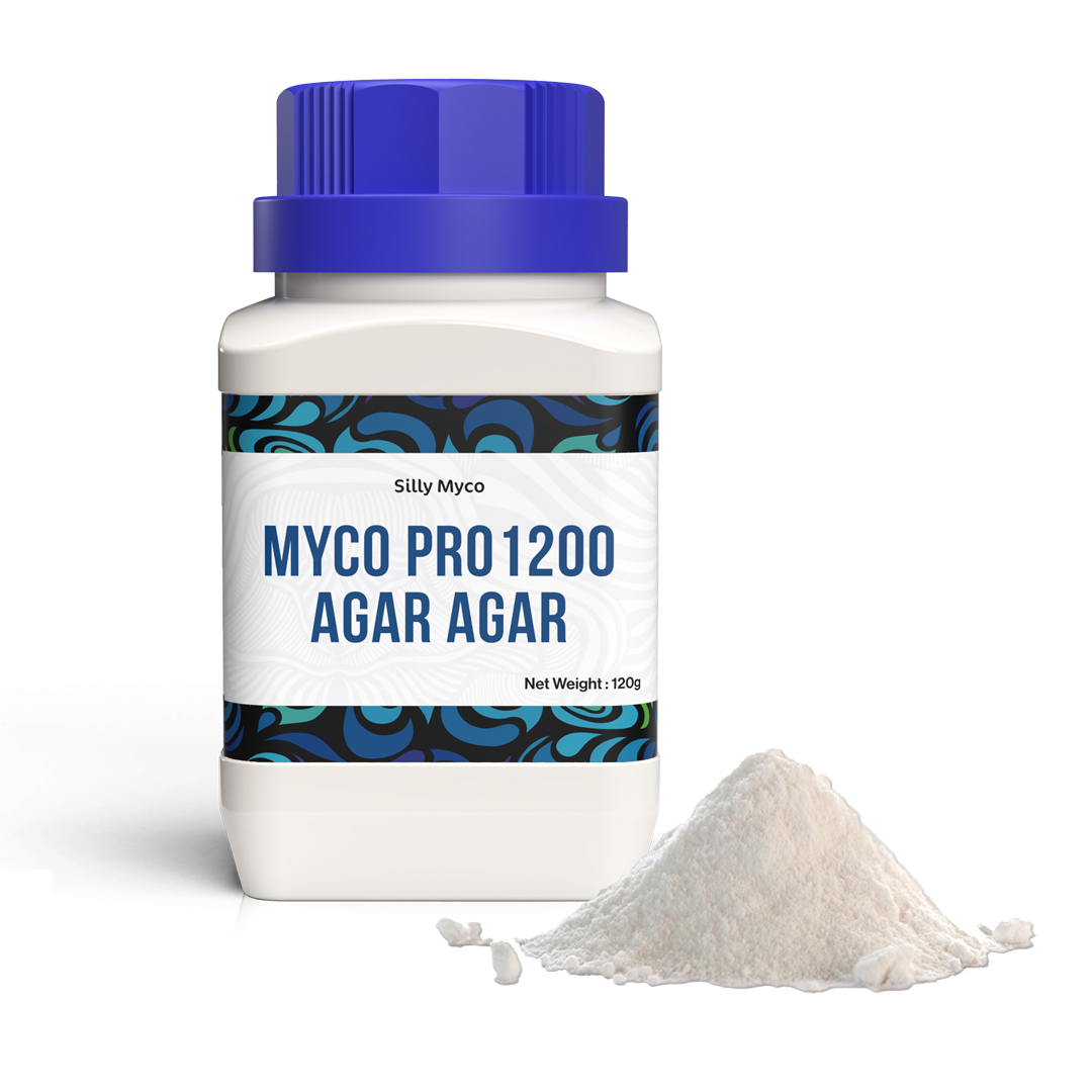 A white bottle of Silly Myco Agar Agar powder with a blue lid beside an off-white pile of the agar agar powder contained in the bottle.