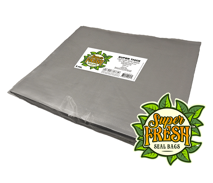 A stack of metallic SuperFresh Seal Bags, each measuring 15x18 inches, with a super thick design for vacuum sealing. The stack features a white label on top with the green and orange SuperFresh logo and product details, including a QR code, set against a dark background.